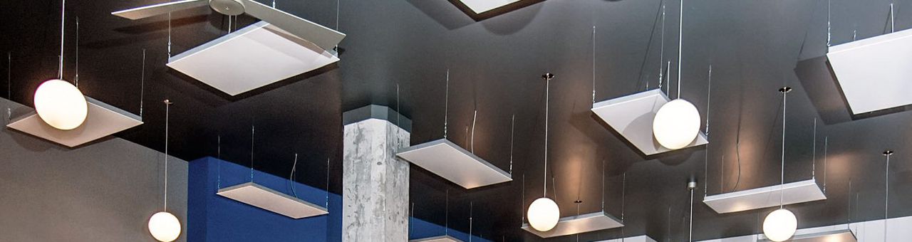 Architectural Series heaters among pendant lights in the ceiling of Hudson Yoga