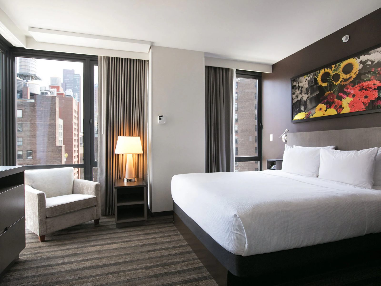 Guest room at Hyatt House in Chelsea, Manhattan, with a floor-to-ceiling window