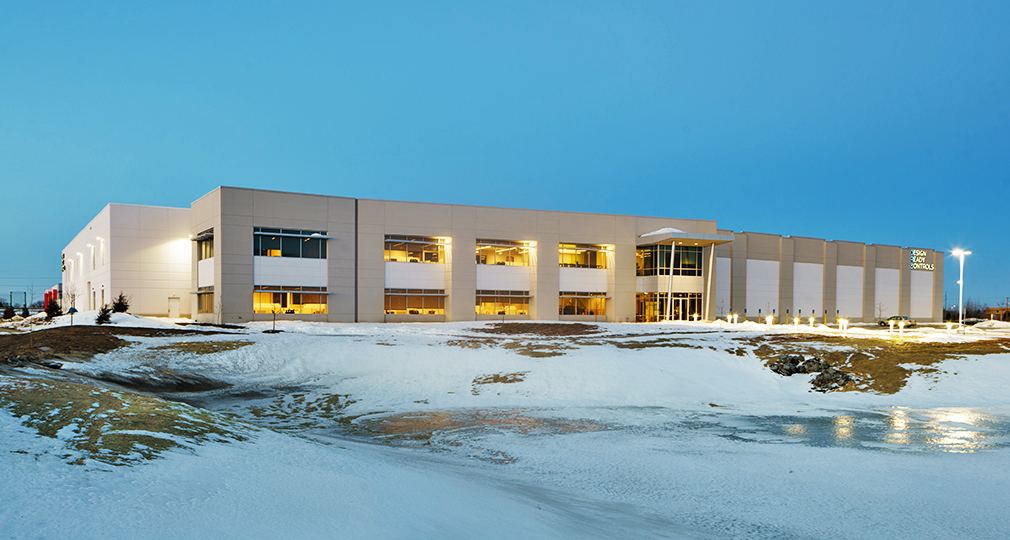 Design Ready Controls building in Brooklyn Park at dusk, with snow in front