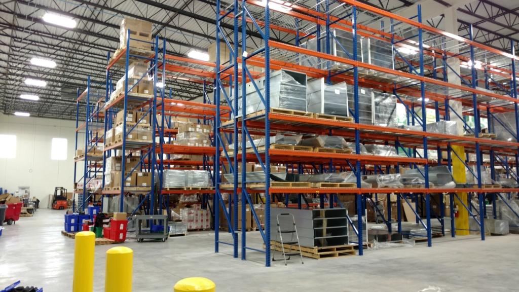Tall pallet racking stocked with product in the Design Ready Controls warehouse