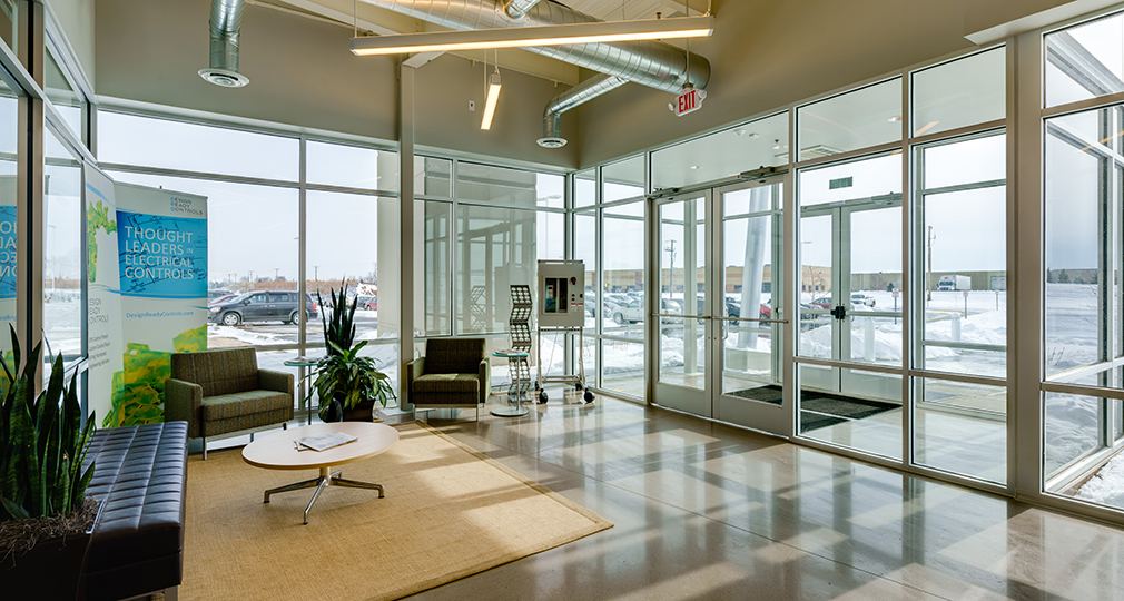 Lobby with floor-to-ceiling windows and lounge seating at Design Ready Controls