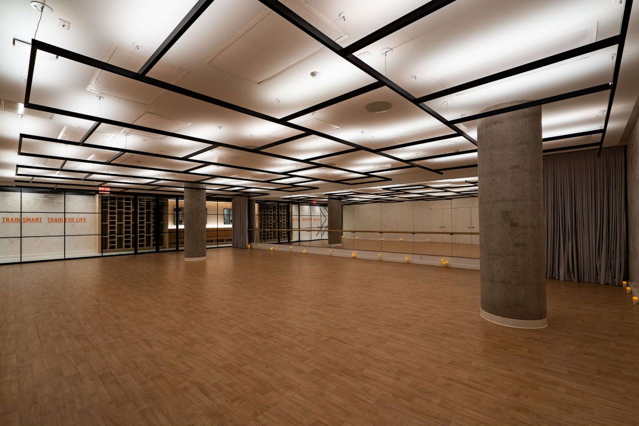 Empty Performance Lab studio at The JACX with Architectural Series heaters in the ceiling grid