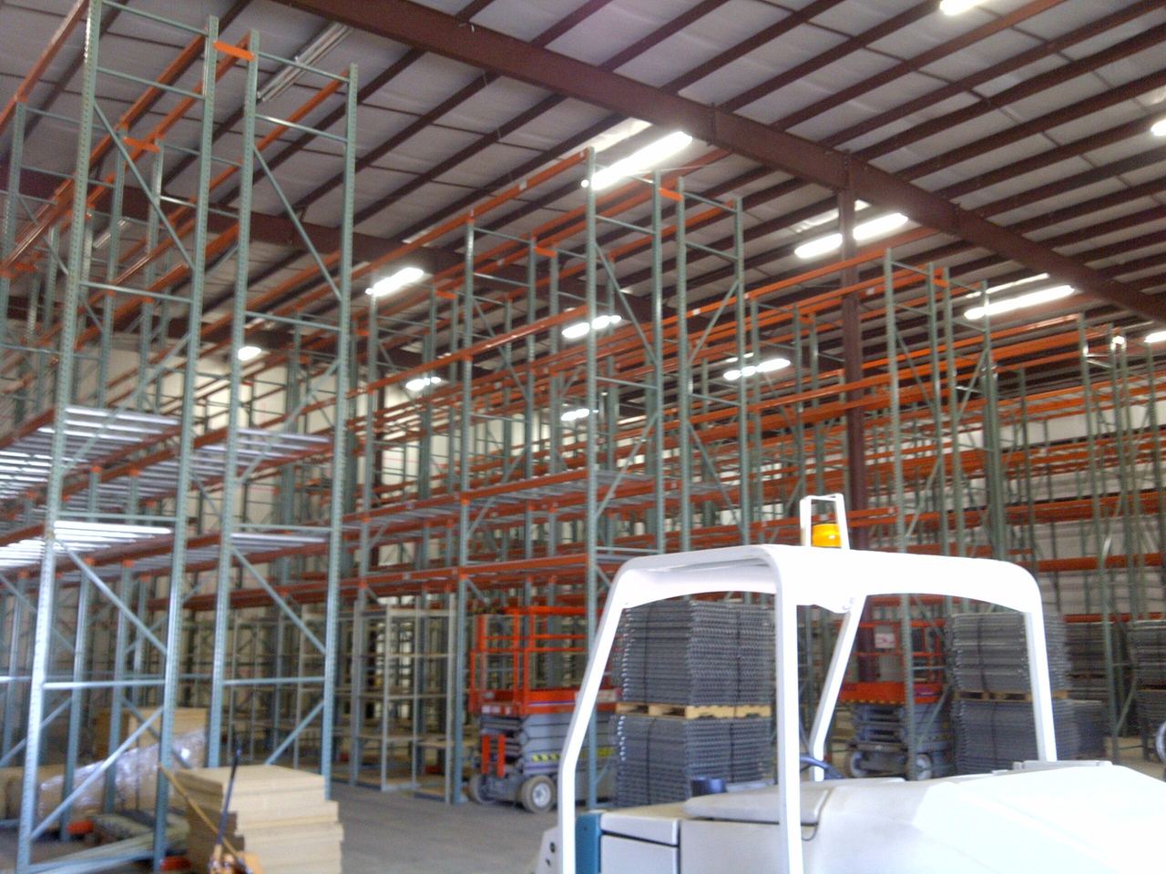Warehouse interior with tall pallet racking being installed