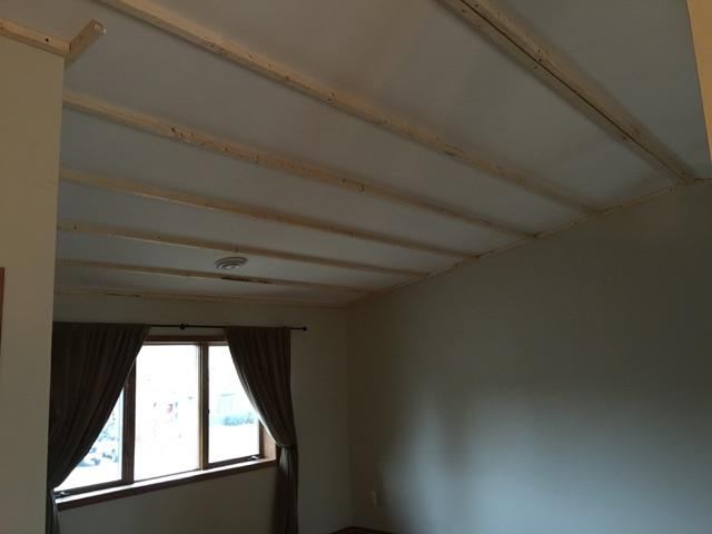 Furring strips fastened across an existing ceiling