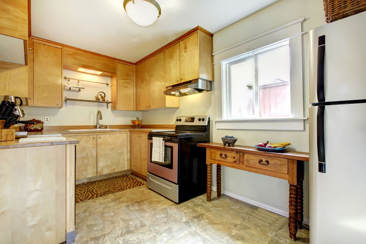Finished kitchen with maple cabinets and a smooth new ceiling