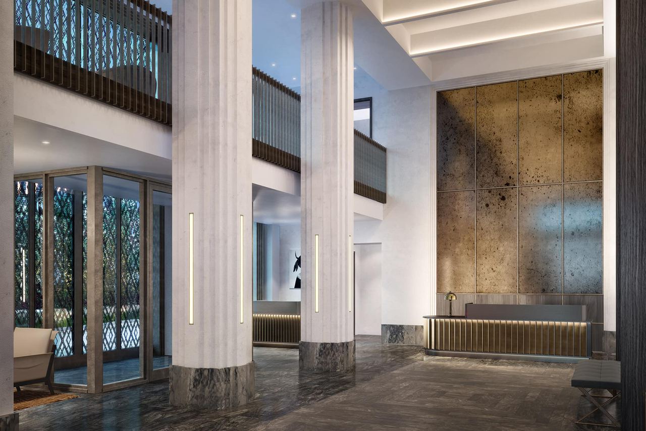 The Vandewater lobby with tall columns and a bronze wall
