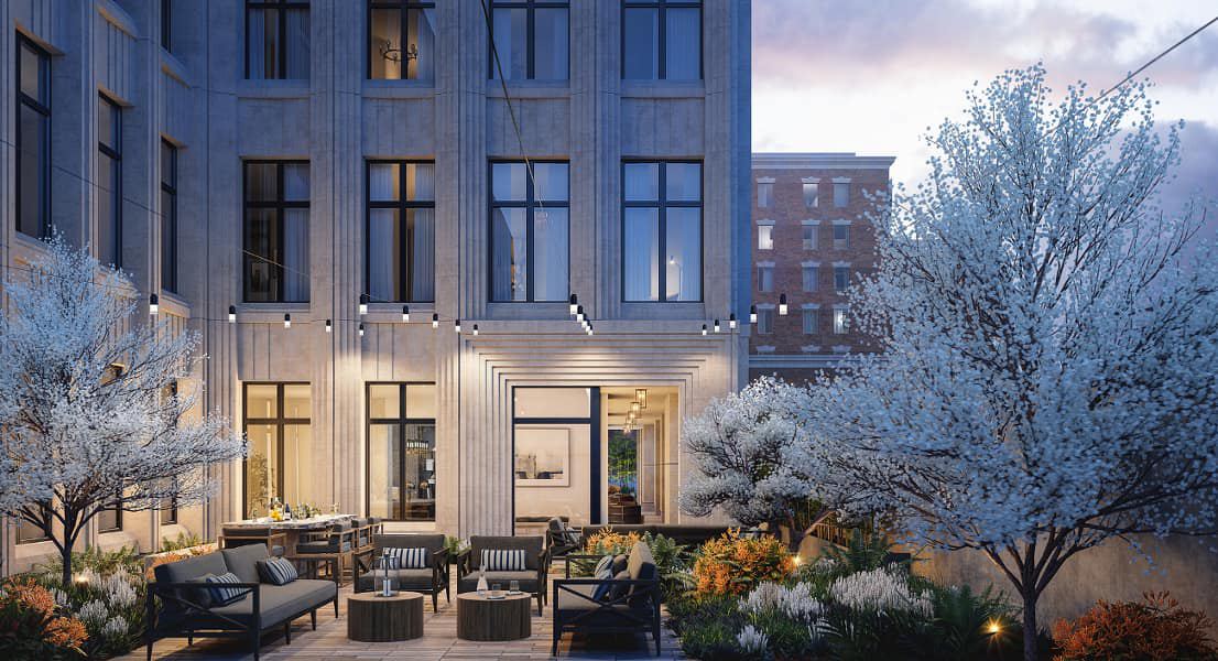 Landscaped courtyard with outdoor seating at dusk