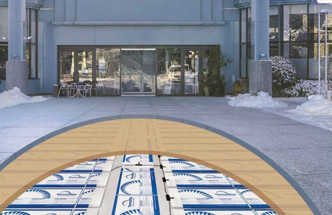 Cutaway drawing of a ThermaRay snow and ice melting system under a paved surface